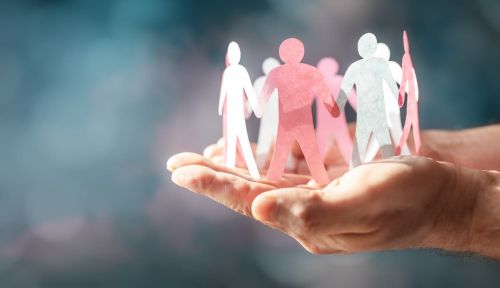 Paper chain of family hand holding. Irrevocable living trust concept.